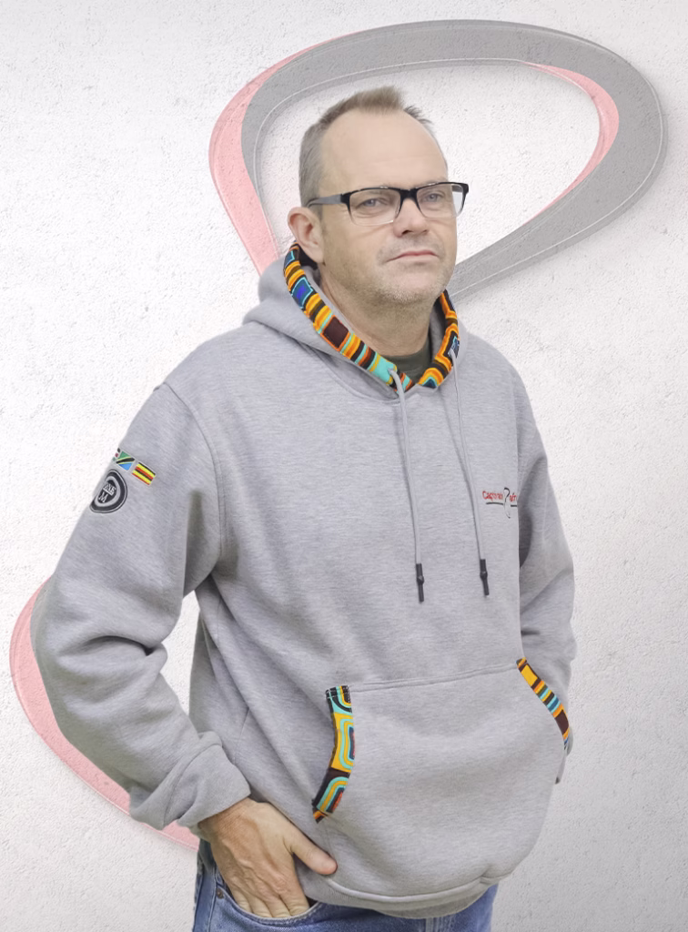 Anthony Stow. Managing Director Captivate Africa Posing with a branded Hoodie