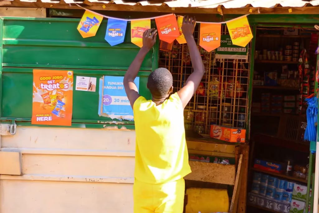 Captivate Africa Brand Ambassador branding a shop