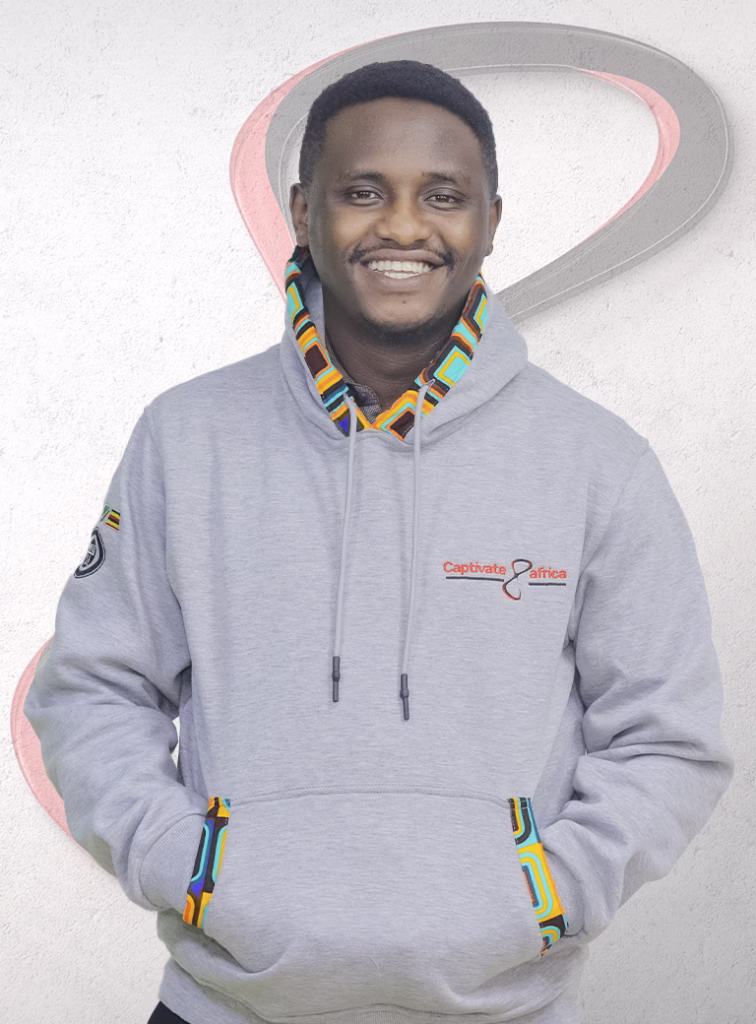 Simon Yonni, IT and Data Officer at Captivate Africa, Posing with a branded hoodie.